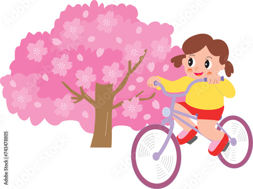 桜と自転車に乗る女の子
