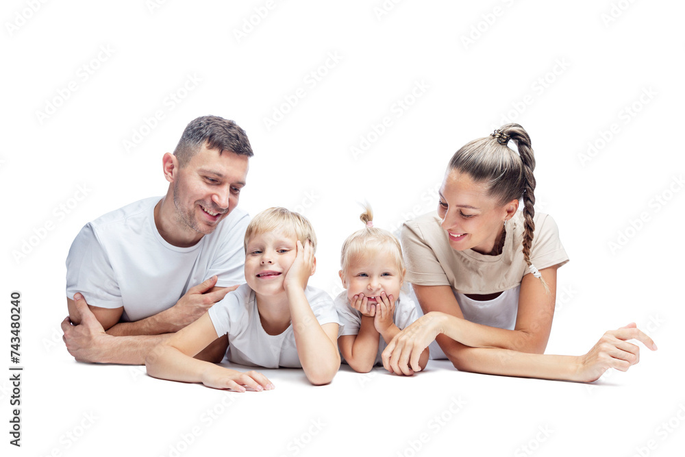 Happy family with children lying on their stomach. Mom, dad, daughter and son in white T-shirts hug and laugh. Love and tenderness. Isolated on a white background.