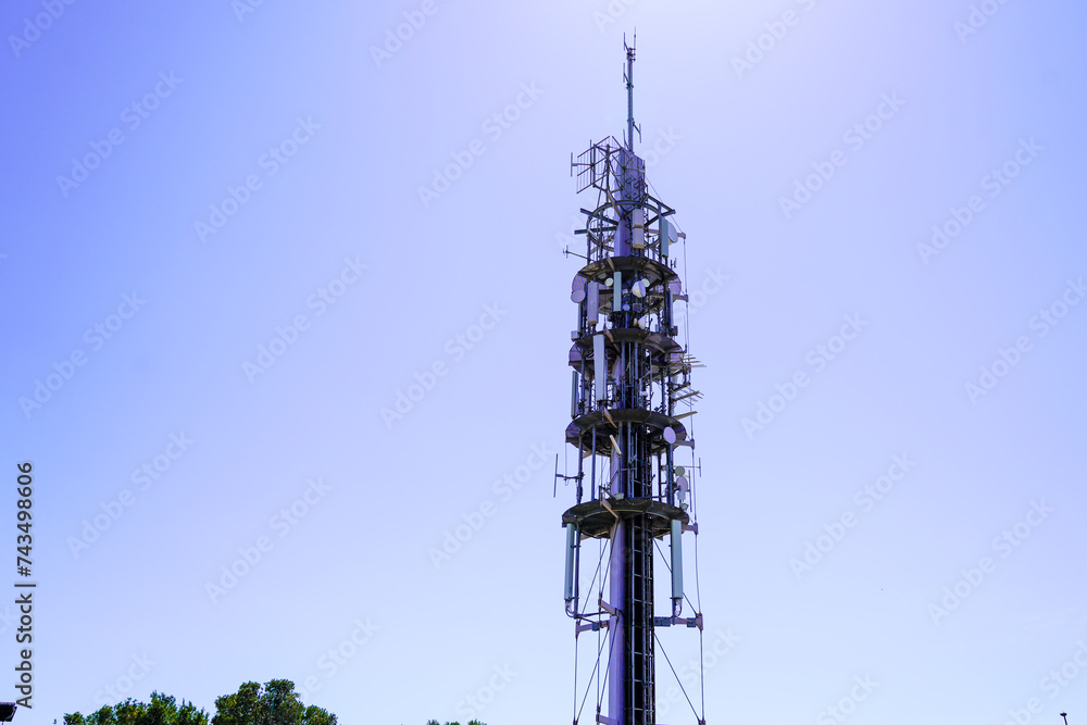 telephone base station mast towers phone waves in sky blue telephone base station mast towers phone waves in sky blue