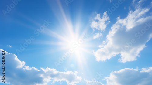 Radiant Summer Sun Shining Brightly in a Clear Blue Sky with Fluffy White Clouds. Weather and Climate Concept