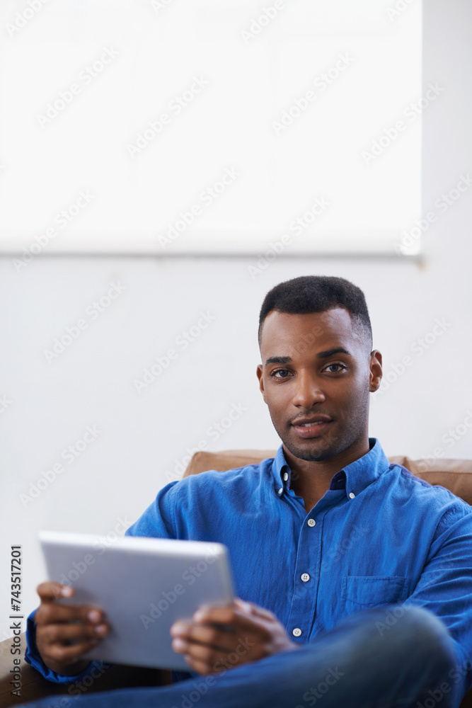 Man, tablet and portrait for social media at home, online and internet for website or blog. Black male person, movies and streaming entertainment on couch, ecommerce and app for shopping on weekend Man, tablet and portrait for social media at home, online and internet for website or blog. Black male person, movies and streaming entertainment on couch, ecommerce and app for shopping on weekend