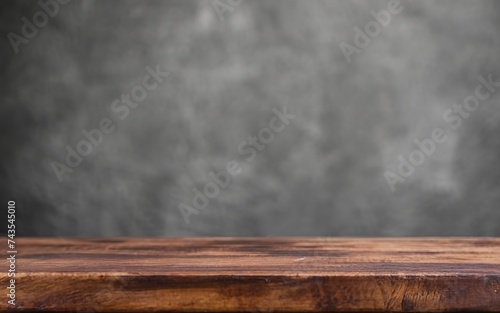 Empty wooden table in front of its background. The wooden table in the front can be used to display or mount your products