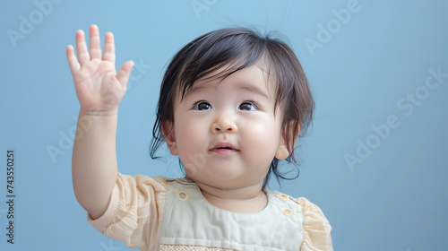 Portrait of a cute baby with raising hands up.Generative AI