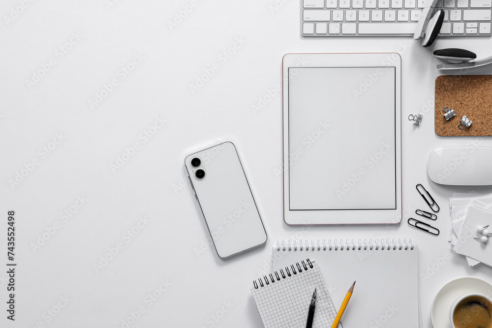 Flat lay composition with modern tablet on white background. Space for text Flat lay composition with modern tablet on white background. Space for text