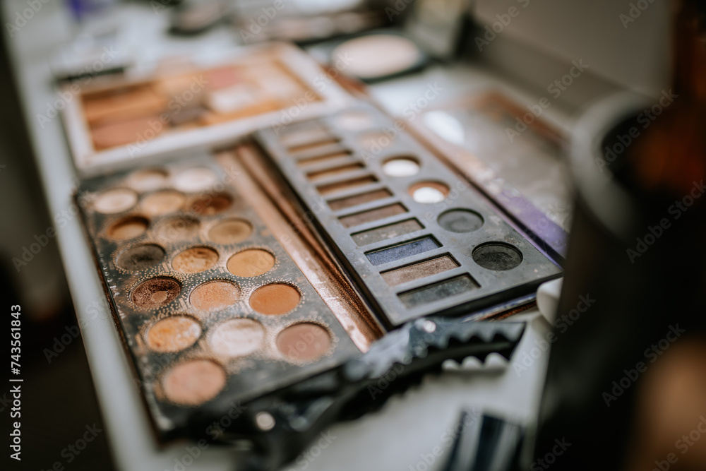 Riga, Latvia - January 20, 2024 - Close-up of various well-used eyeshadow palettes with an array of colors Riga, Latvia - January 20, 2024 - Close-up of various well-used eyeshadow palettes with an array of colors