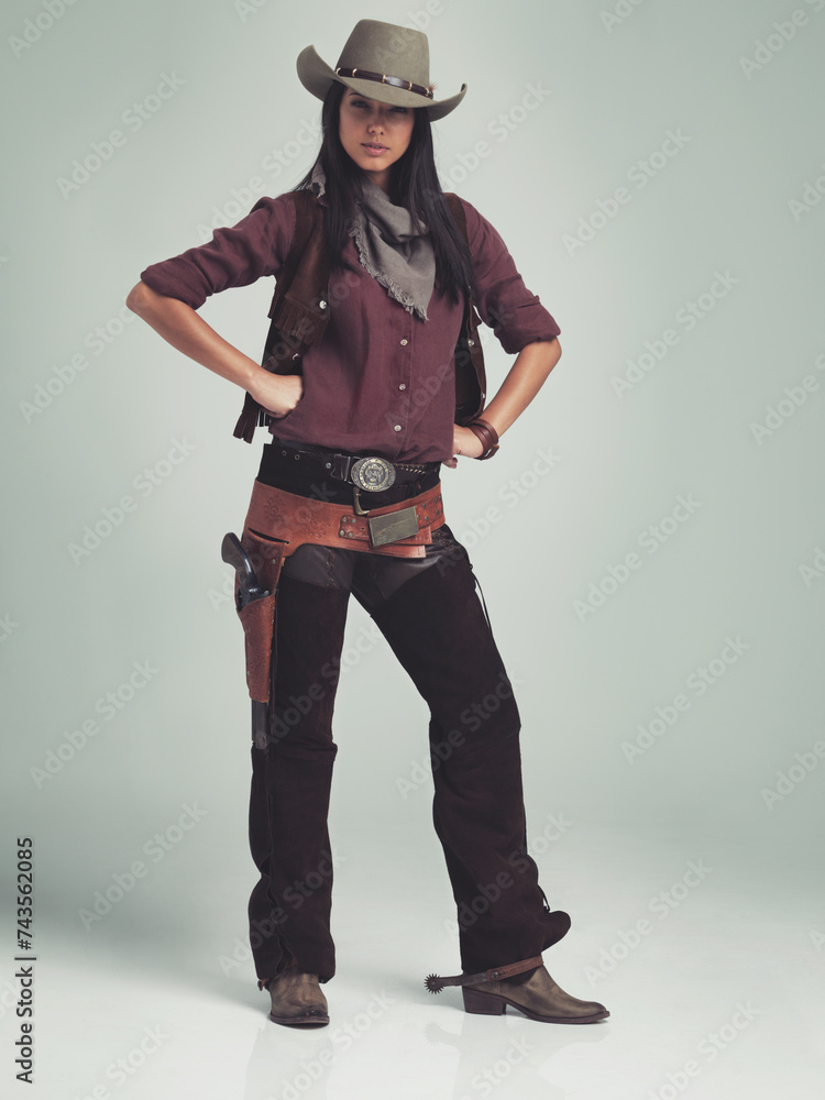 Woman, fashion and cowboy clothes with portrait in studio, western character and costume on white background. Wild west style, outlaw cosplay and vintage apparel with confidence and aesthetic Woman, fashion and cowboy clothes with portrait in studio, western character and costume on white background. Wild west style, outlaw cosplay and vintage apparel with confidence and aesthetic