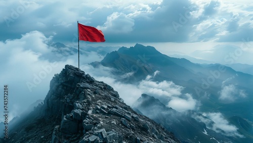 Aerial photography of a red flag on a steep mountain peak