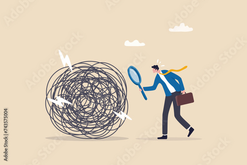 Analyze problem finding solution or opportunity, look for details to solve problem, discovery or search, root cause analysis or troubleshooting concept, businessman analyze mess with magnifying glass. photo