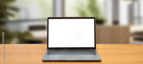 Laptop computer on desk at office or co-working space, Laptop with white blank on screen and blurred background , working space concept.