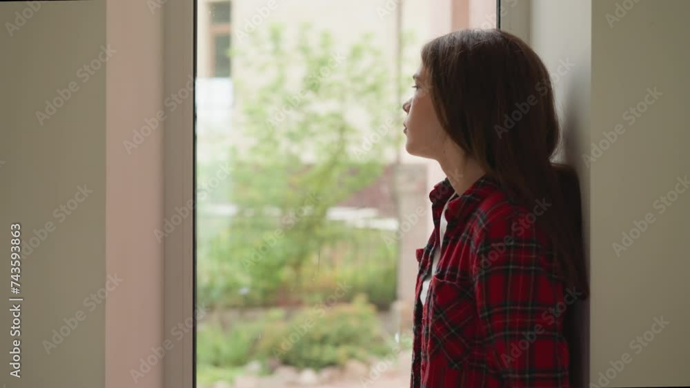 Pensive woman stands alone in corridor. Thoughtful lady suffers from parents refusing to accept homosexuality at home. Mental health disorders impact Pensive woman stands alone in corridor. Thoughtful lady suffers from parents refusing to accept homosexuality at home. Mental health disorders impact