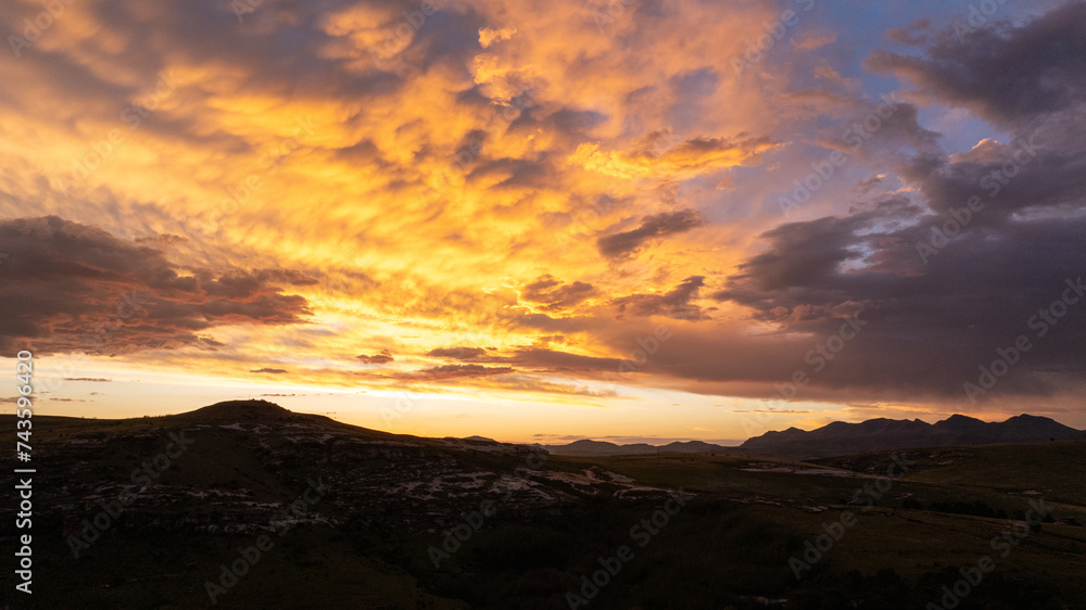 A drone photograph of moody, deep color rich clouds at sunset. Shot over the Eastern Free State province in South Africa.