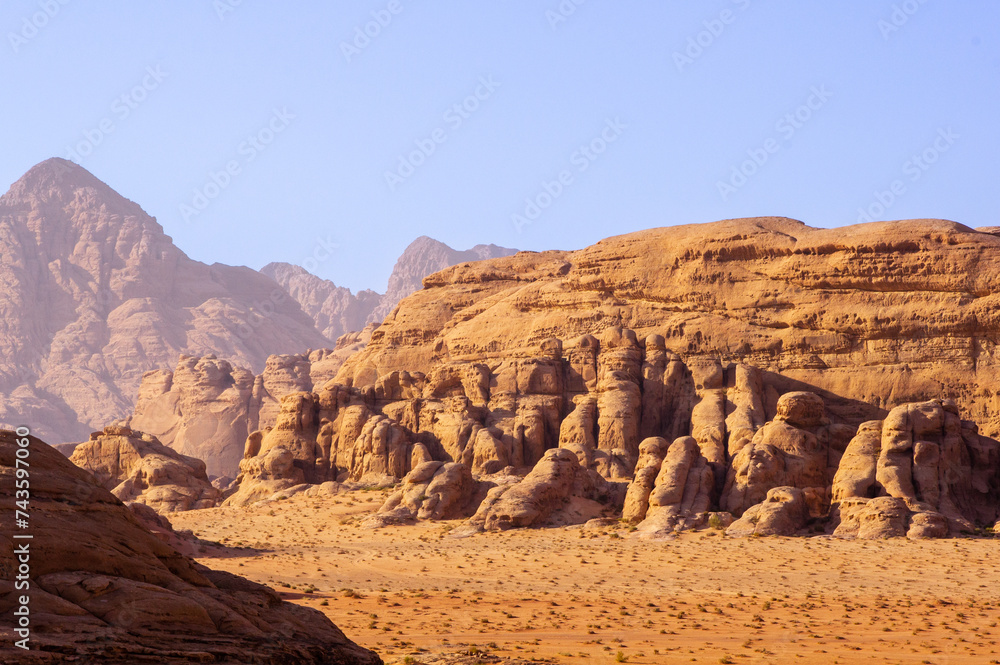 Jordan, Wadi Rum desert. Incredible landscapes with vibrant colors on all sides. Martian city surrounded by incredible rocks and mountains of bizarre shapes with most unusual architecture.