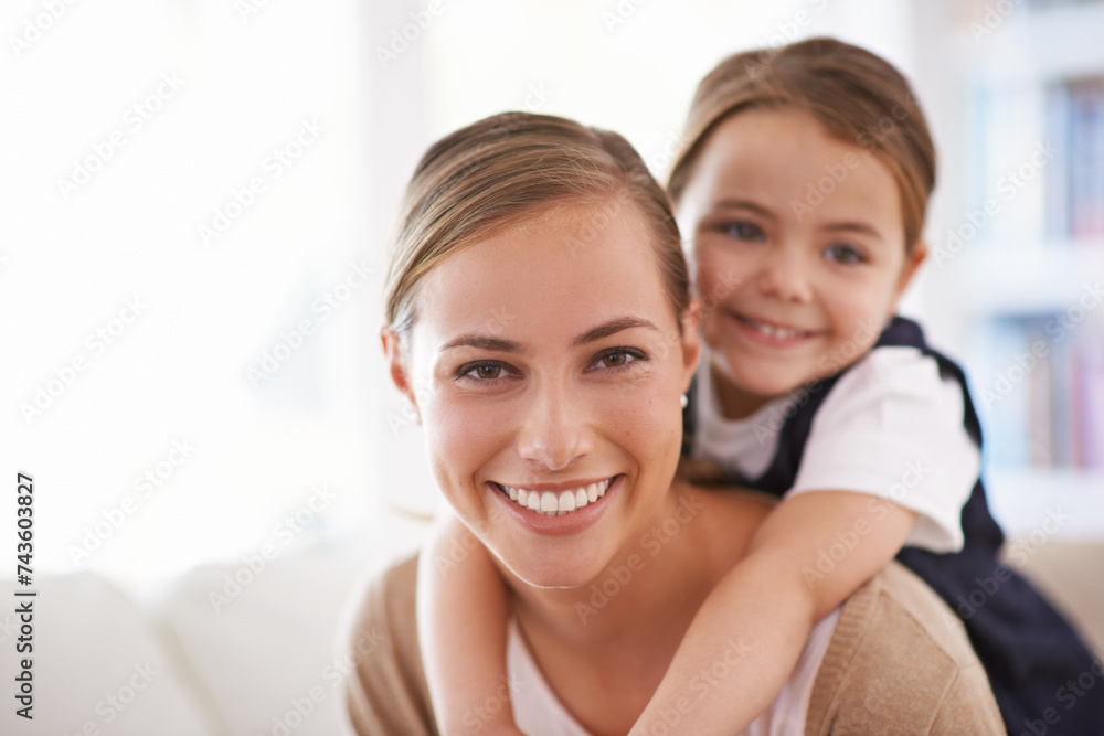Mother, child and piggyback in portrait with games in family home, love and bonding with smile while playing. Playful woman, young girl and happy in living room with fun time together for childhood Mother, child and piggyback in portrait with games in family home, love and bonding with smile while playing. Playful woman, young girl and happy in living room with fun time together for childhood