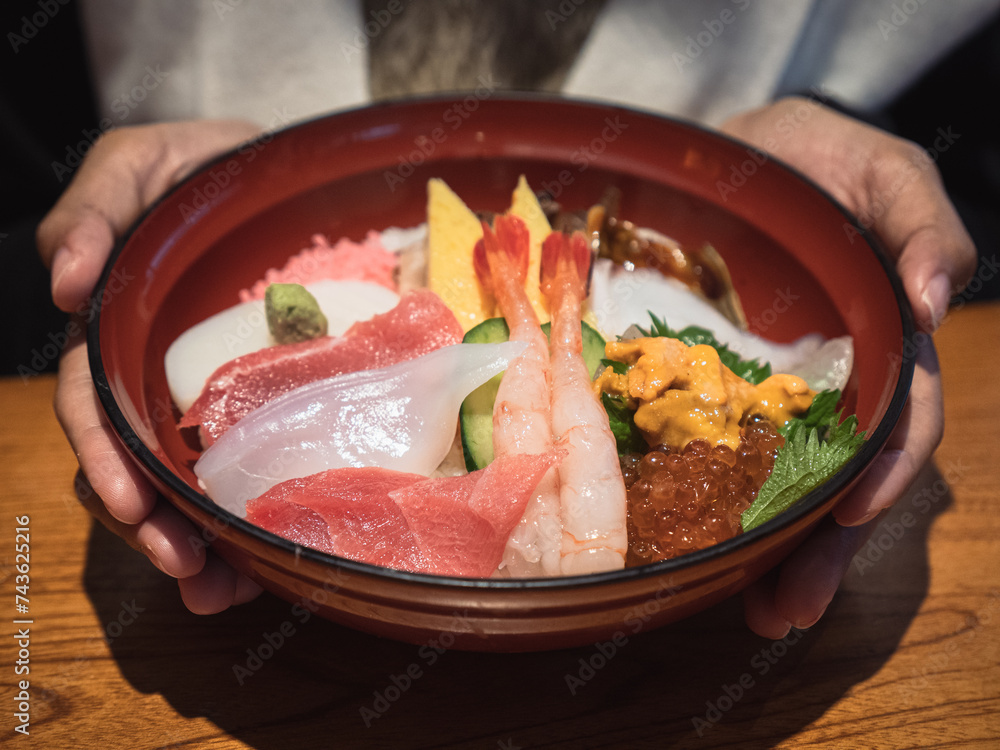 Big set of mix sashimi - fresh fish on top of rice bowl in Japanese restaurant Big set of mix sashimi - fresh fish on top of rice bowl in Japanese restaurant
