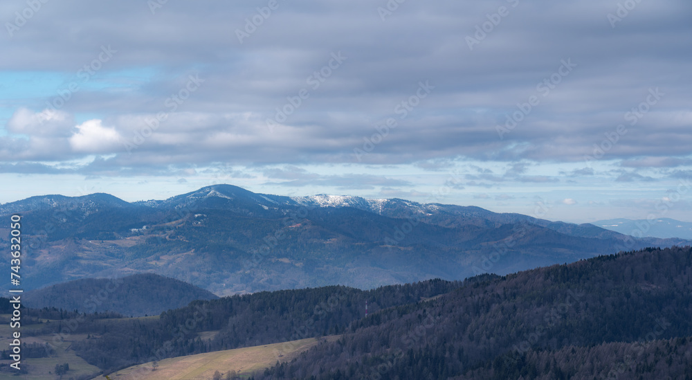 Panorama of Radziejowa Range in early spring, view from village Wierchomla. Beskid Sadecki Mountains, Poland.