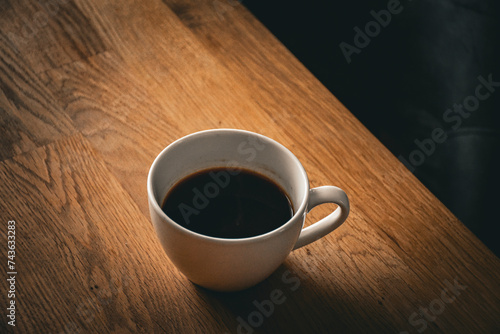 ceramic cup of hot coffee on the table