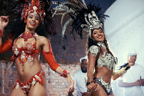 Portrait, carnival or women in costume dancing for celebration, music culture or samba in Brazil. Girl friends, night or dancers with rhythm or fashion at festival, parade or show in Rio de Janeiro