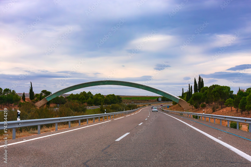 Naklejka premium on the highway in Spain. Greenwich meridian is ahead