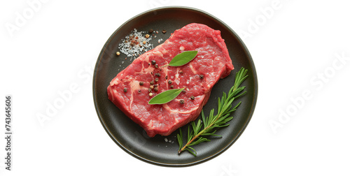 Meat steak arranged in a plate in the center, top view, white background