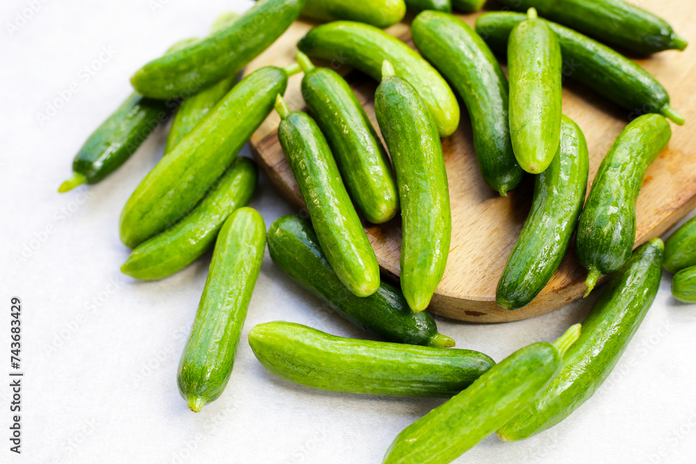 Fresh mini cucumbers. Eating vegetables for health Fresh mini cucumbers. Eating vegetables for health