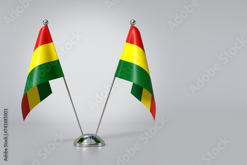 Double Plurinational State of Bolivia Table Flag on Gray Background. 3d Rendering photo