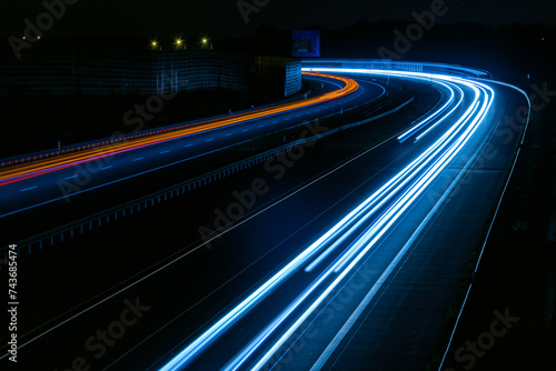 lights of cars driving at night. long exposure