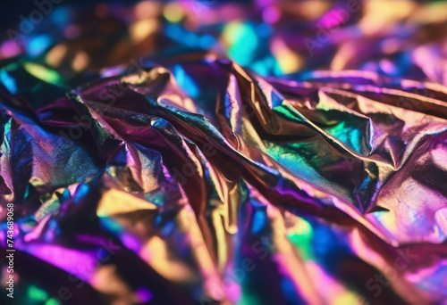 Iridescent holographic textural Background Wrinkled folded paper or foil with iridescent highlights photo