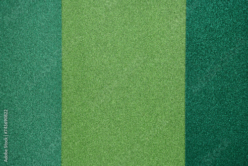 Green glitter paper of different shades. St Patrick's holiday background for greeting cards or banner templates