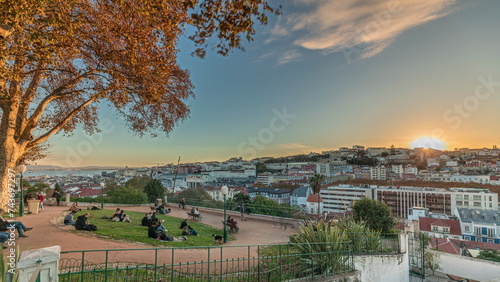 Panorama showing Jardim do Torel timelapse with views to the city center of Lisbon during sunset. Portugal