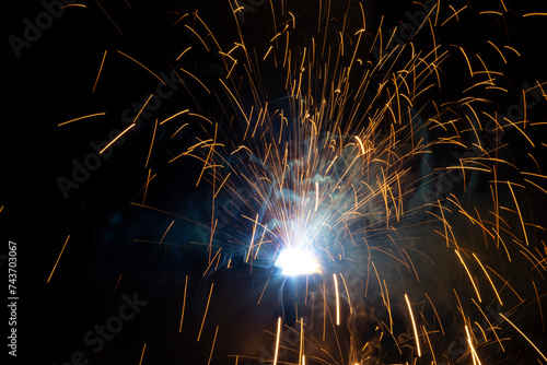Sparks and flash from electric welding