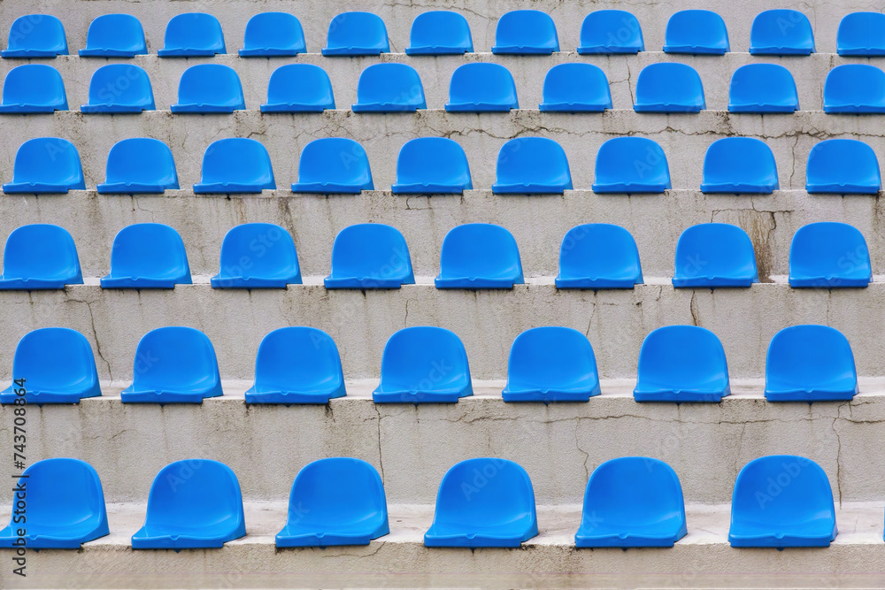 Fototapeta premium Plastic blue seats rows on street auditorium or stadium. No people
