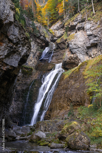 Waterfall of the strait (Estrecho waterfall) in autumn in the Ordesa Valley National Park in Aragon Pyrenees. Huesca, Spain. Ara river waterfalls.