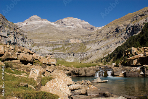 Ara river waterfalls in the Soaso circus in the Ordesa Valley National Park in Aragon Pyrenees with the Lost Peak (Monte Perdido) in the background. Huesca, Spain. photo