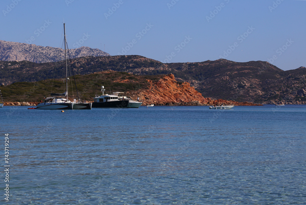 Yacht and catamaran in Capo Coda Cavallo beach near San Teodoro in Sardinia, Italy