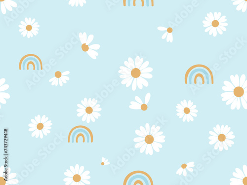 Seamless pattern with daisy flower and rainbows on blue background vector illustration. Cute childish print.