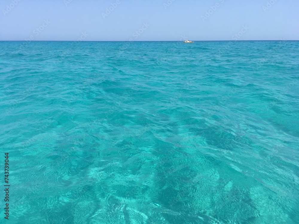 Turquoise sea water in Cala Mesquida beach in Mallorca Islands, Spain