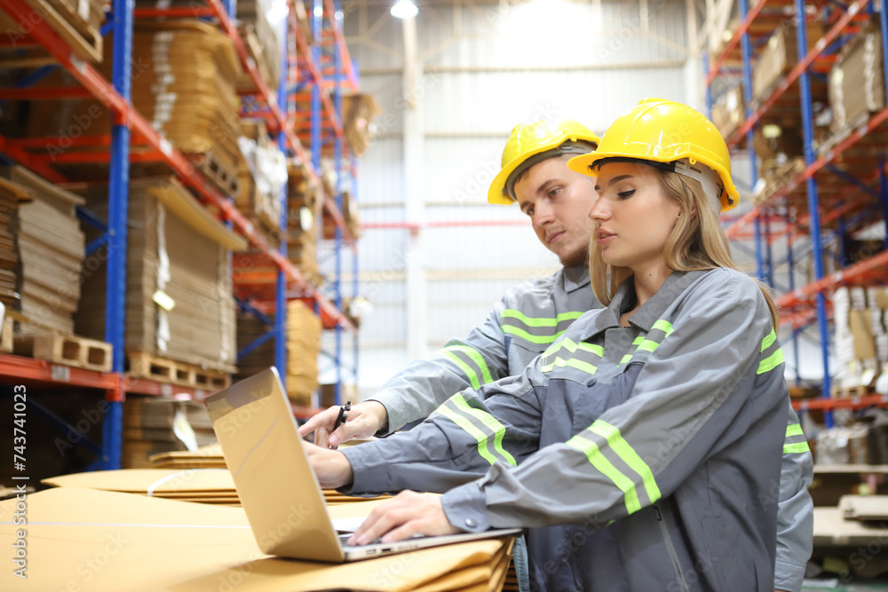 worker or engineer working in factory with safety uniform , safety hat and safety glasses , image is safety concept or happy workplace worker or engineer working in factory with safety uniform , safety hat and safety glasses , image is safety concept or happy workplace