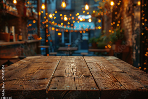 Rustic wooden table with soft focus lights and a blurred restaurant background