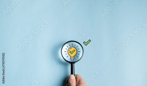 concept creativity of work, creativity for new innovations with energy and power, growth and development of success. Light bulb and idea check icon inside magnifying glass.