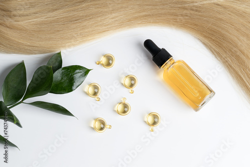 Blonde hair with oil treatment and green leaves