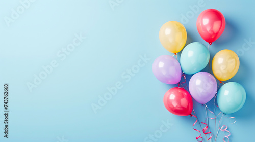 Colorful Balloons Floating on Soft Azure © Andrii 