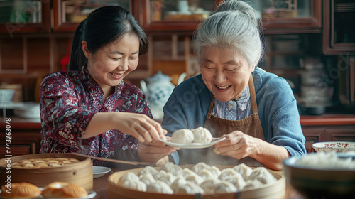asian family is preparing new year dumplings 