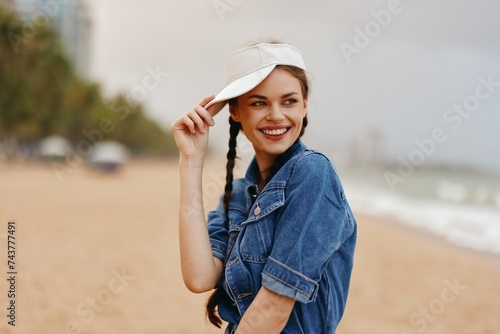 Happy Summer Fashion: Pretty Caucasian Woman with Stylish Hat and Smiling Face Enjoying Outdoor Vacation in a Green Park with Sunny Nature Background © SHOTPRIME STUDIO