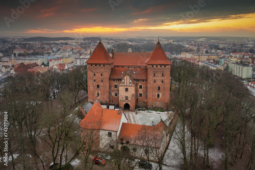Fototapeta Naklejka Na Ścianę i Meble -  Teutonic castle in Nidzica at sunset, Poland.