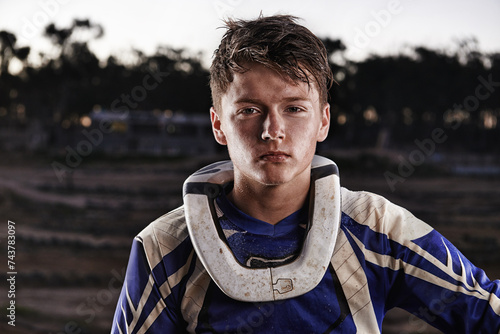 Fototapeta Naklejka Na Ścianę i Meble -  Sports, mud and portrait of man biker on offroad in gear for race, challenge or competition. Serious, adventure and face of male athlete motorcyclist with dirt at action motorcross rally outdoor.