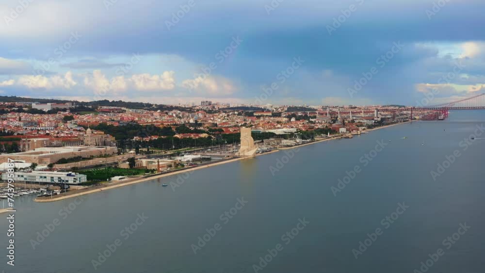 Drone view of the Monument of the Discoveries located in the city's waterfront with cloudy sky on background Drone view of the Monument of the Discoveries located in the city's waterfront with cloudy sky on background