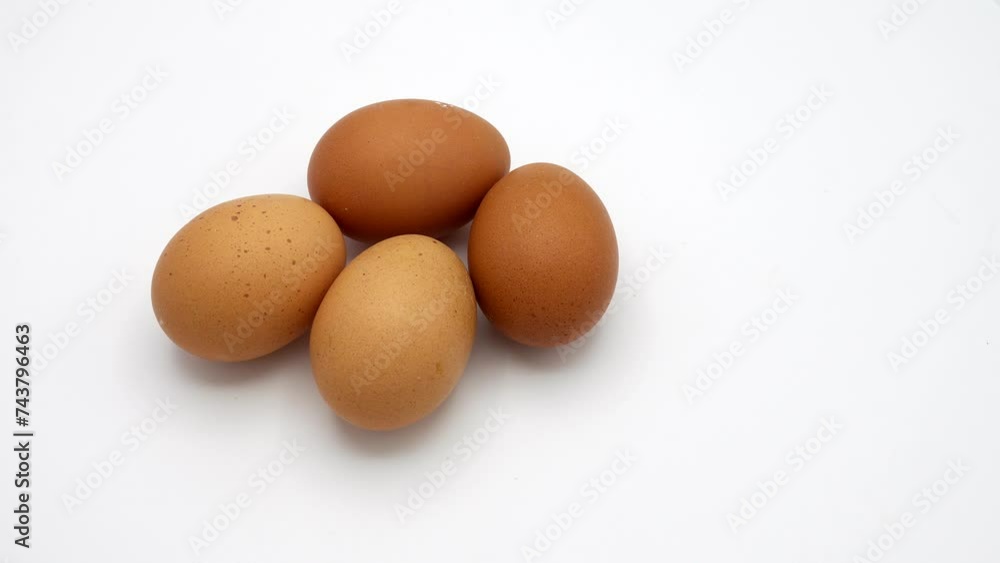 Eggs on white background rotating.