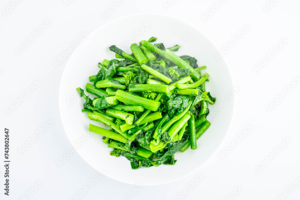 A plate of fried rapeseed greens A plate of fried rapeseed greens