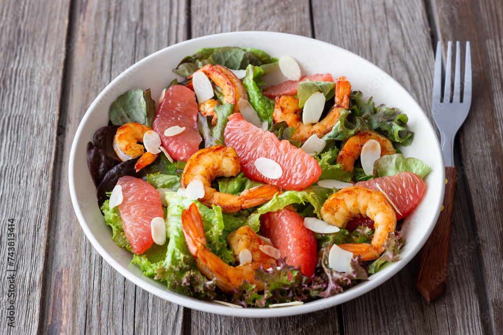 Salad with grapefruit, shrimps and almonds. Healthy eating. Diet. Salad with grapefruit, shrimps and almonds. Healthy eating. Diet.