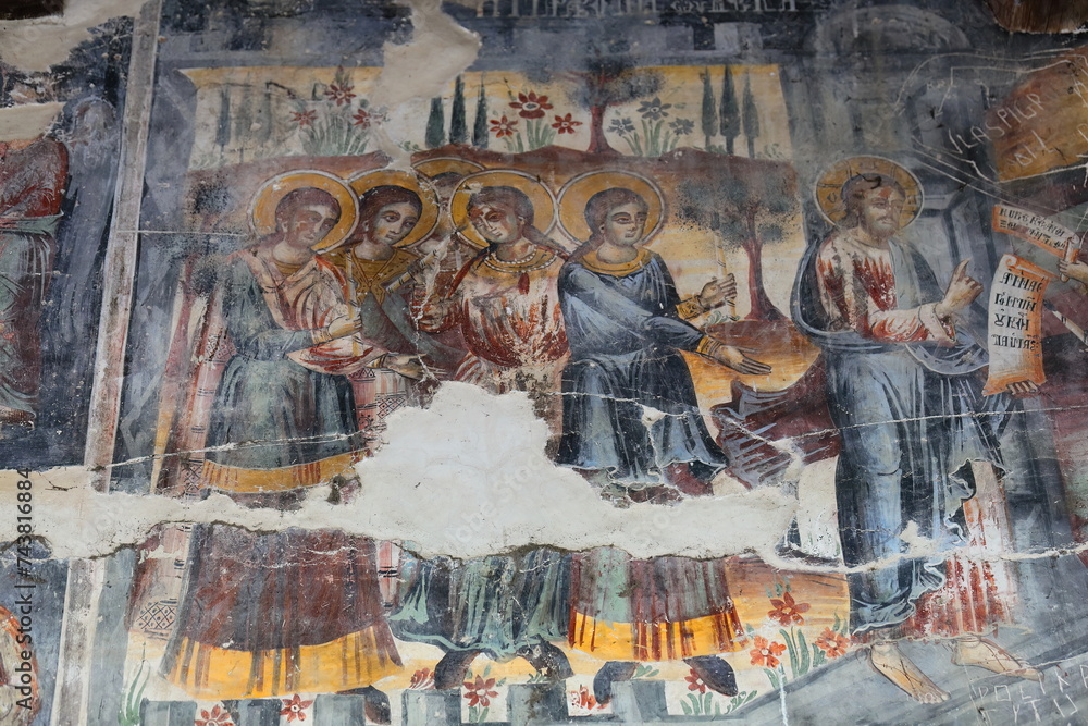 Wall frescoes in Saint Mary's Church of Leusa with its vandalized murals from AD 1812 depicting Bible scenes. Permet-Albania-228